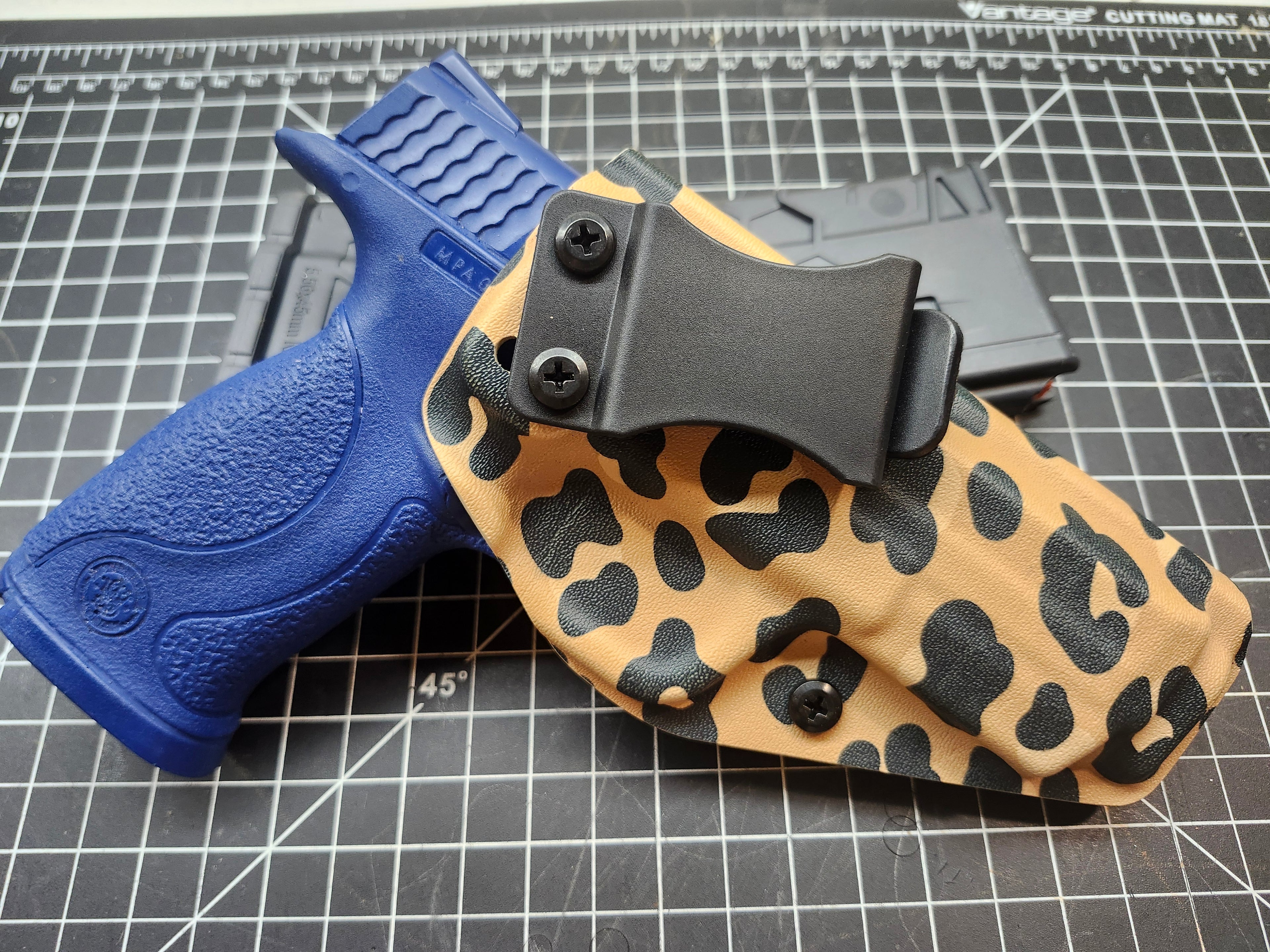 IWB Custom Kydex holster in specialty leopard print. Adjustable cant and retention.